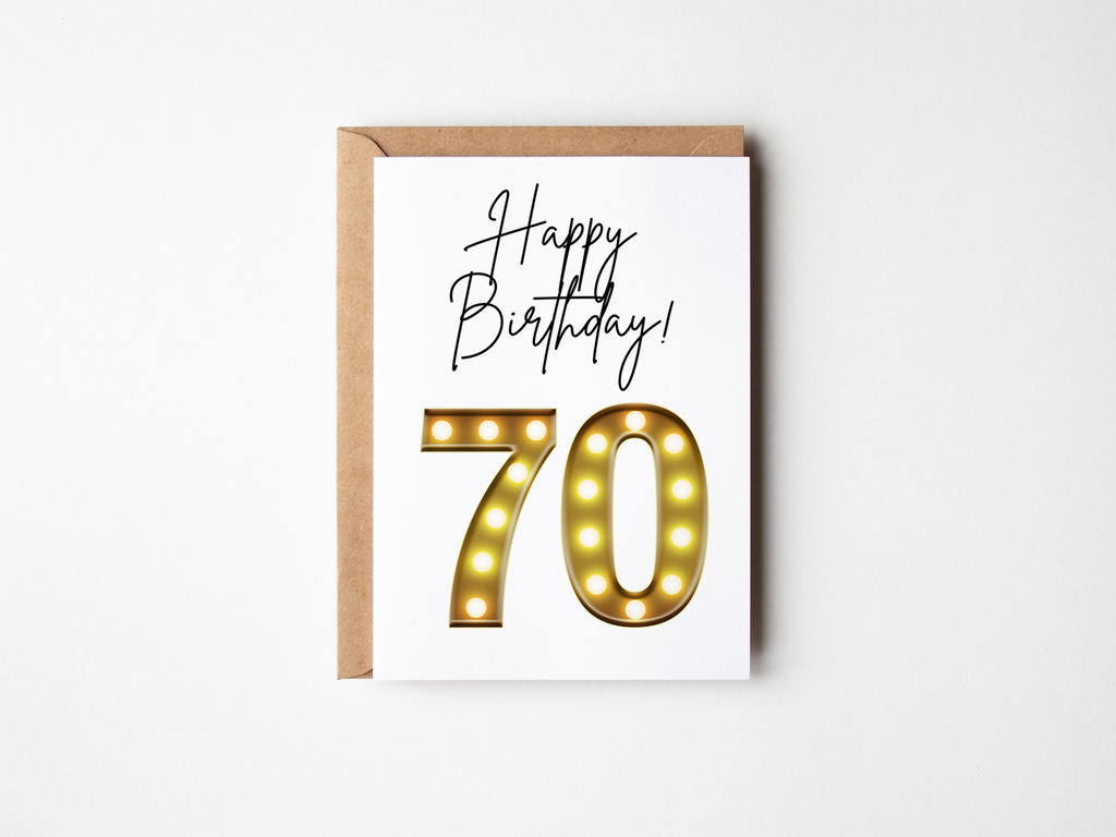 70th birthday card with marquee lights on a white background