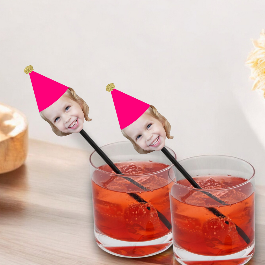Custom face drink stirrers with pink and gold party hat