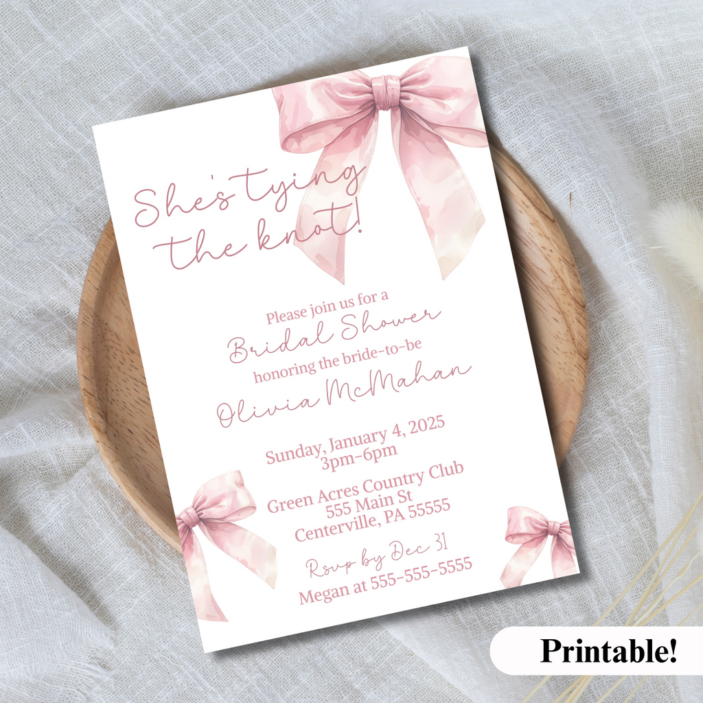 She 's tying the know invitation for bridal shower