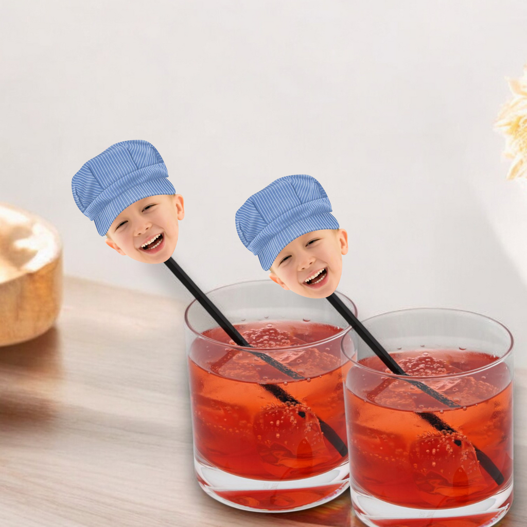 Train themed drink stirrers with face and conductor hat