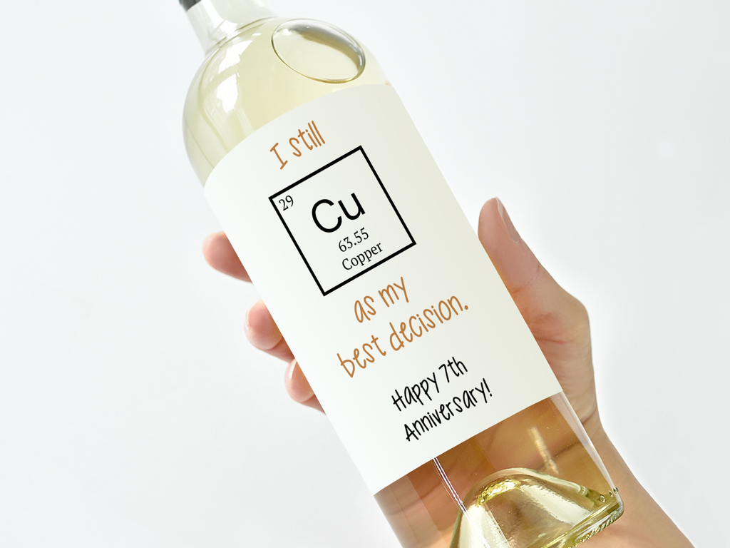 single bottle of white wine with the copper anniversary label on top